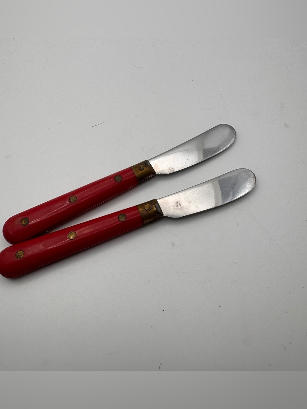 Two vintage French butter knives Mid-Century  Melron made in France. Red Handle
